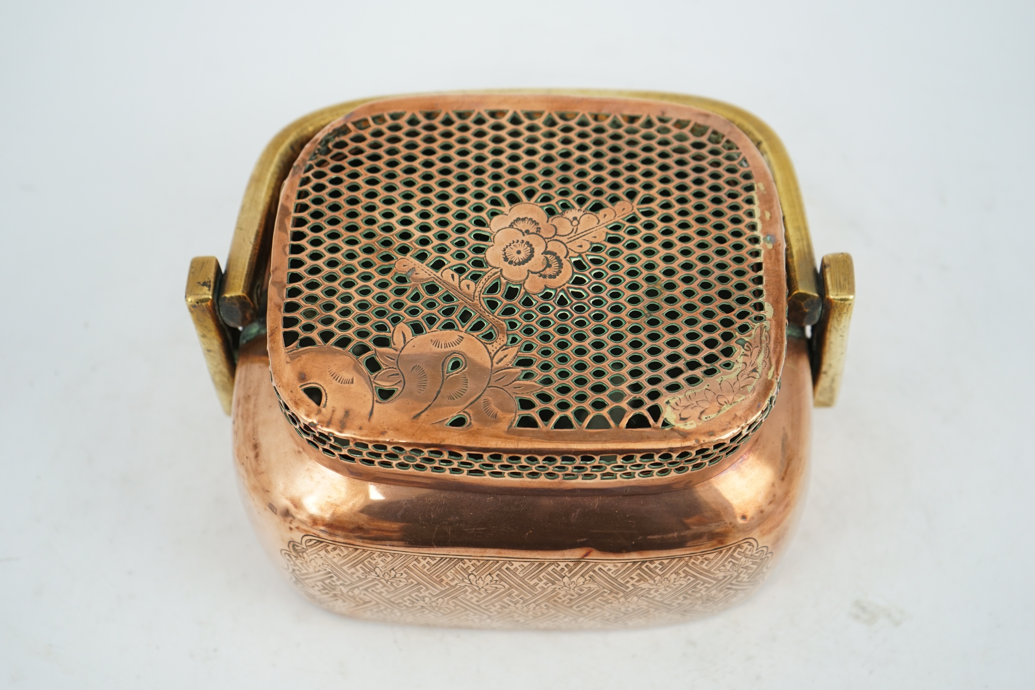 A Chinese copper alloy hand warmer, 18th century